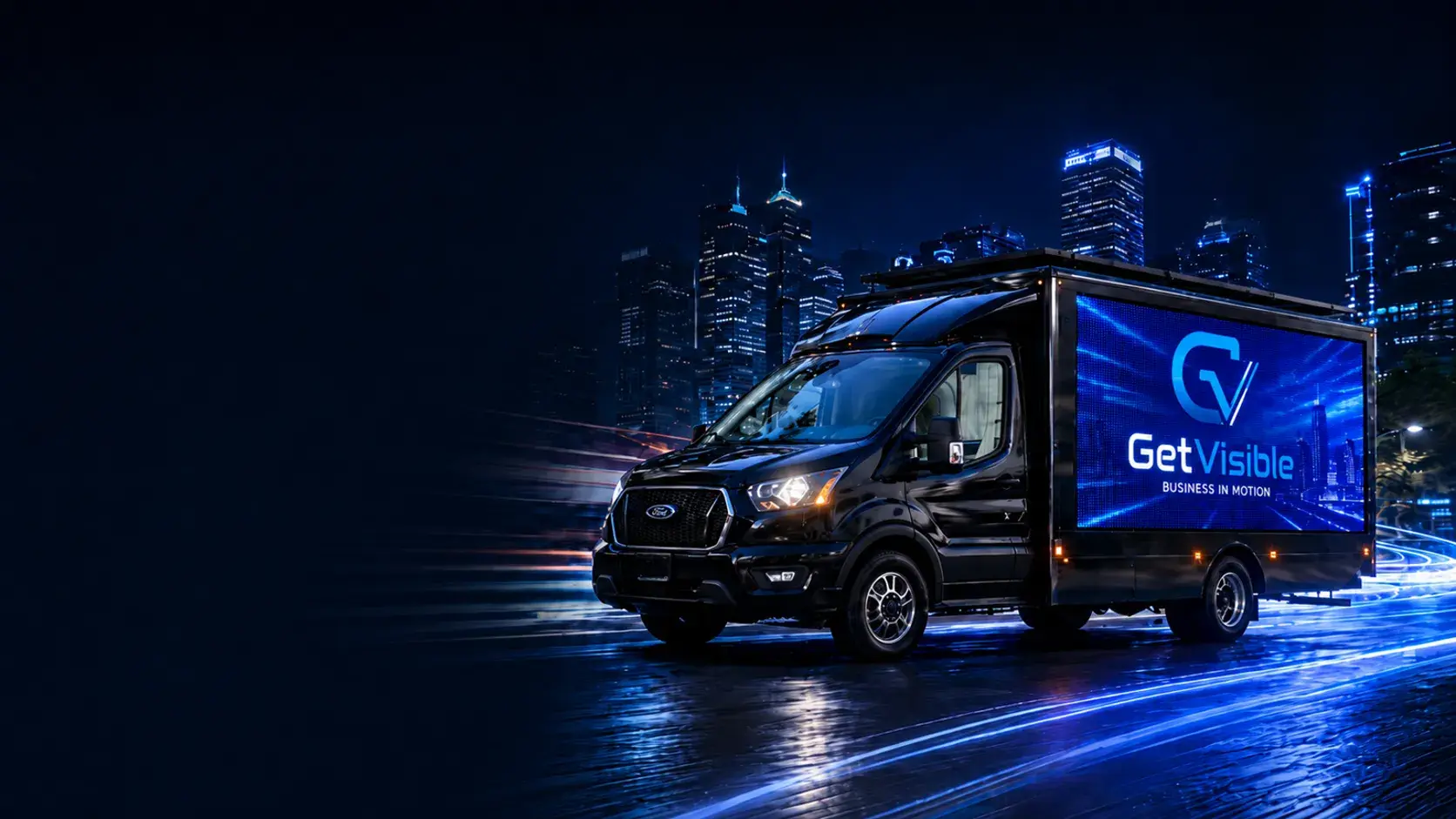 Get Visible mobile LED advertising truck driving through a city at night